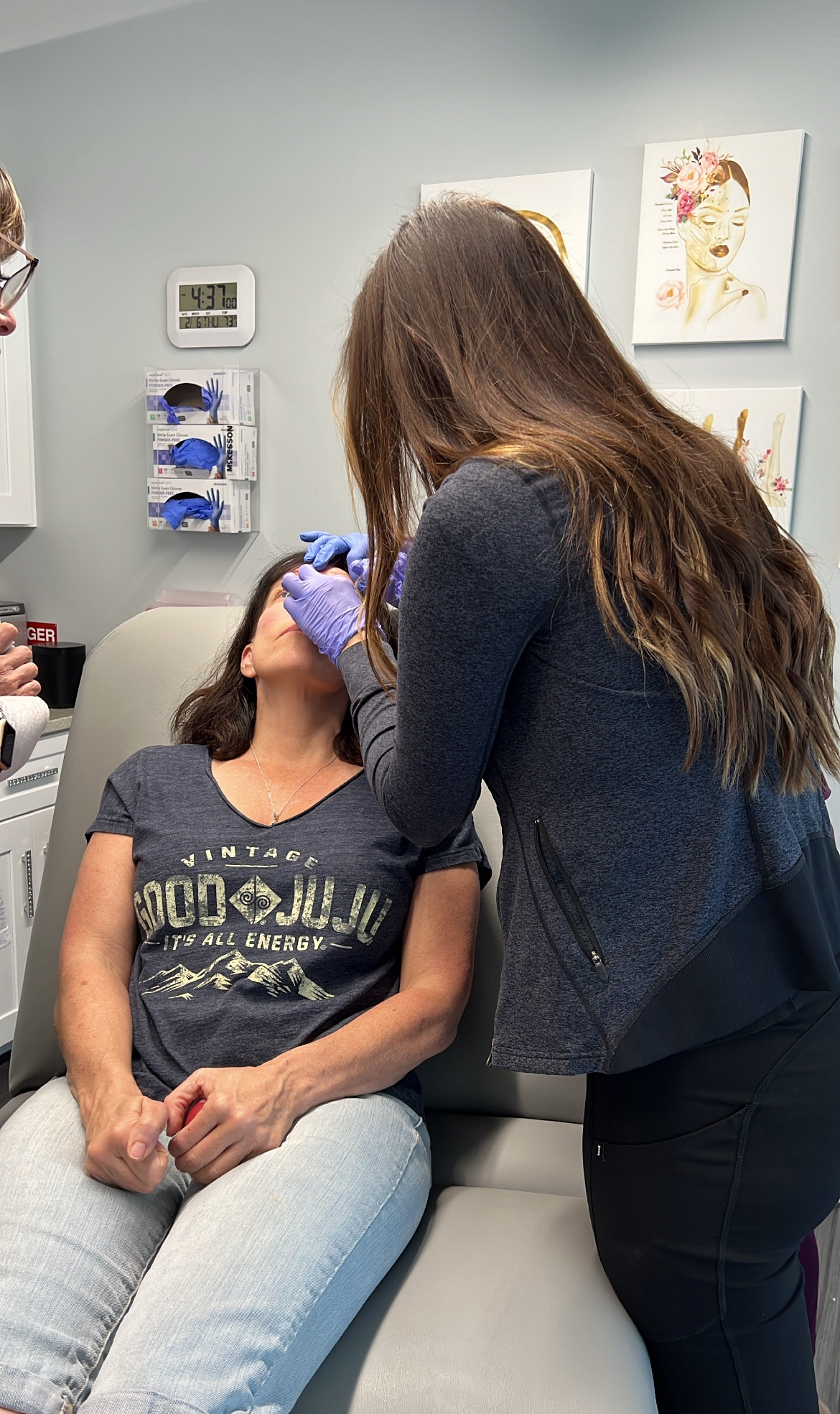 A patient in the treatment room receiving Juvederm in Denver Colorado