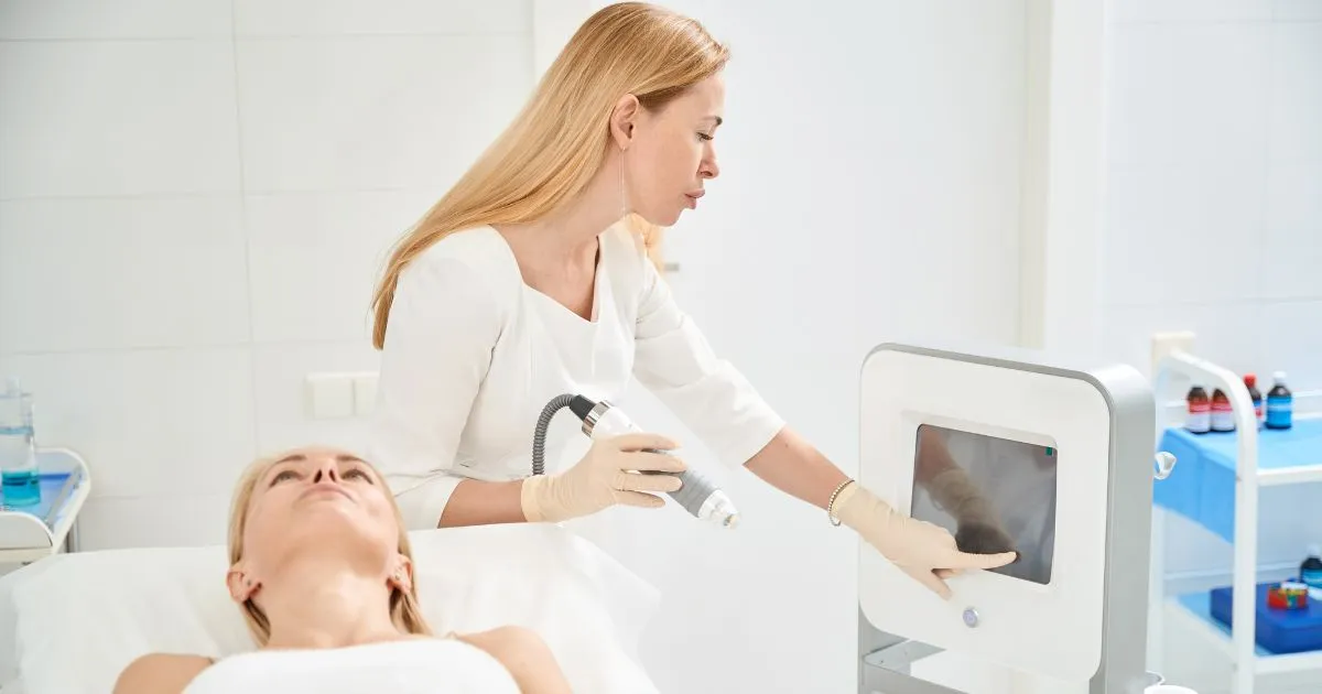 Blonde aesthetician performing Scarlet SRF Microneedling on a patient in Denver, CO